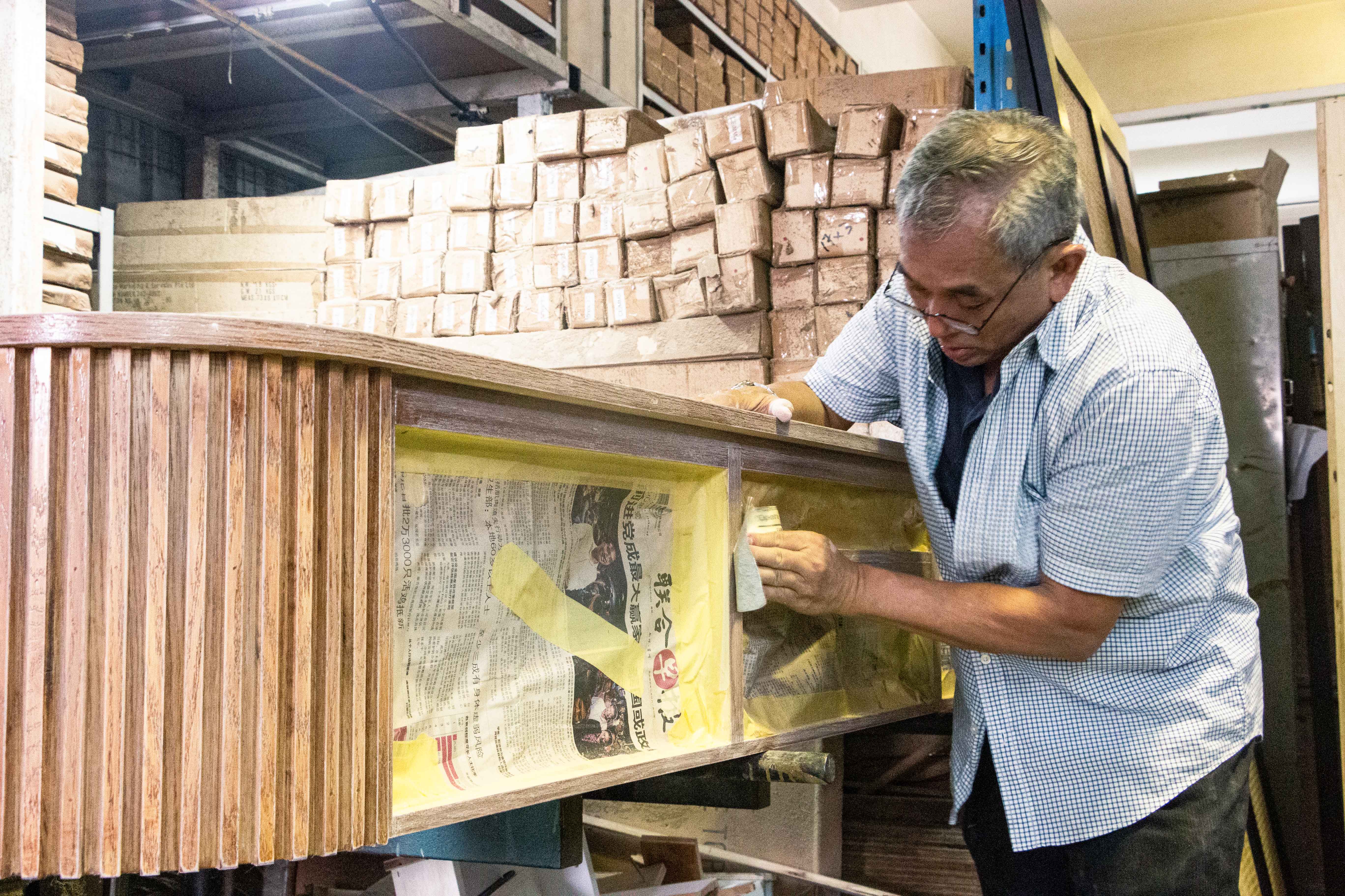 MEGA craftsman working on furniture in workshop